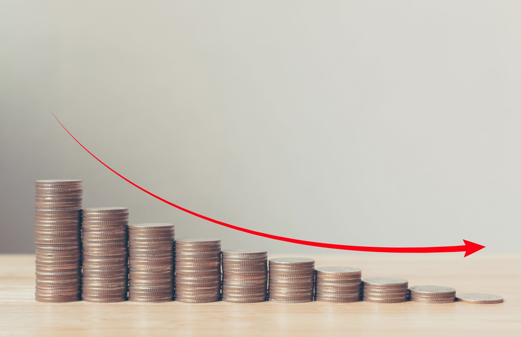 Coin stack step down graph with red arrow, Risk management business financial and investment